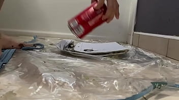 Crushing soda can with painted bare feet