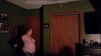 Christine Krug takes off her shear to show her fat belly