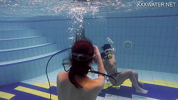 Adeline being filmed by a girl in the pool